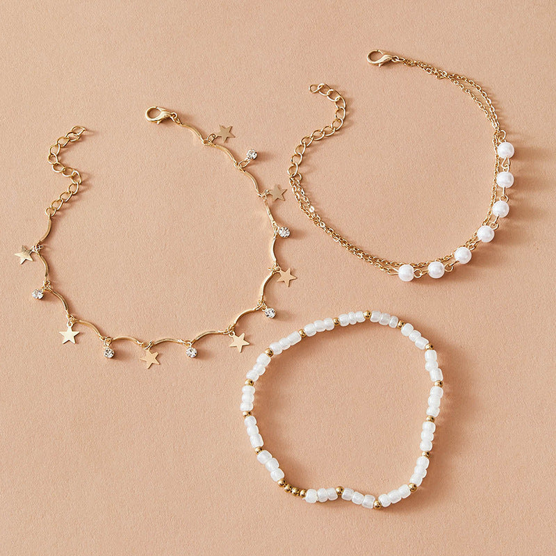 Dreiteiliges Set aus Quaste, fünfzackiger Stern, Reisperlen, Metall-Fußkettchen, weiblich bylotrend
